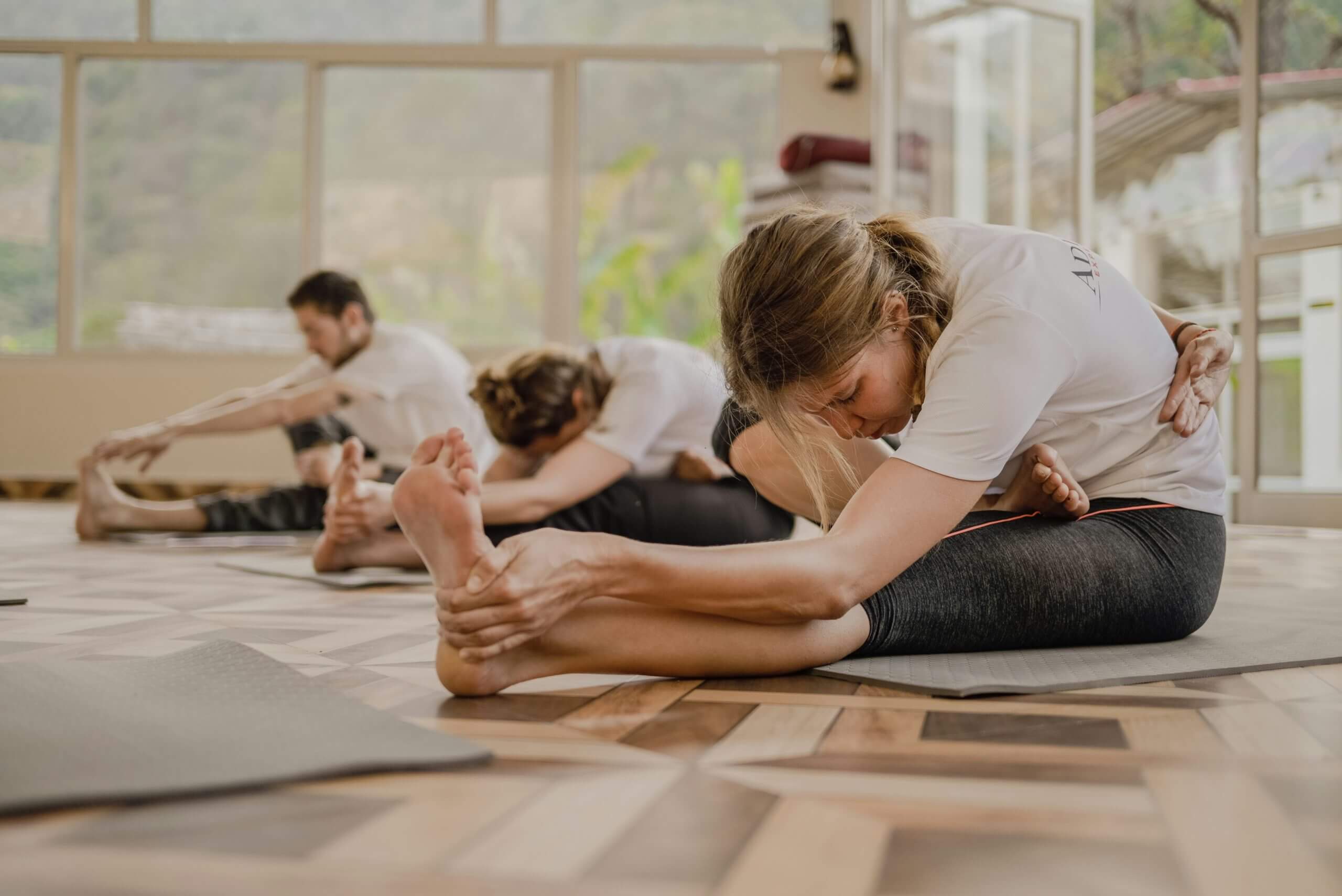 Young woman practicing yoga at Advanced Orthopedic Center